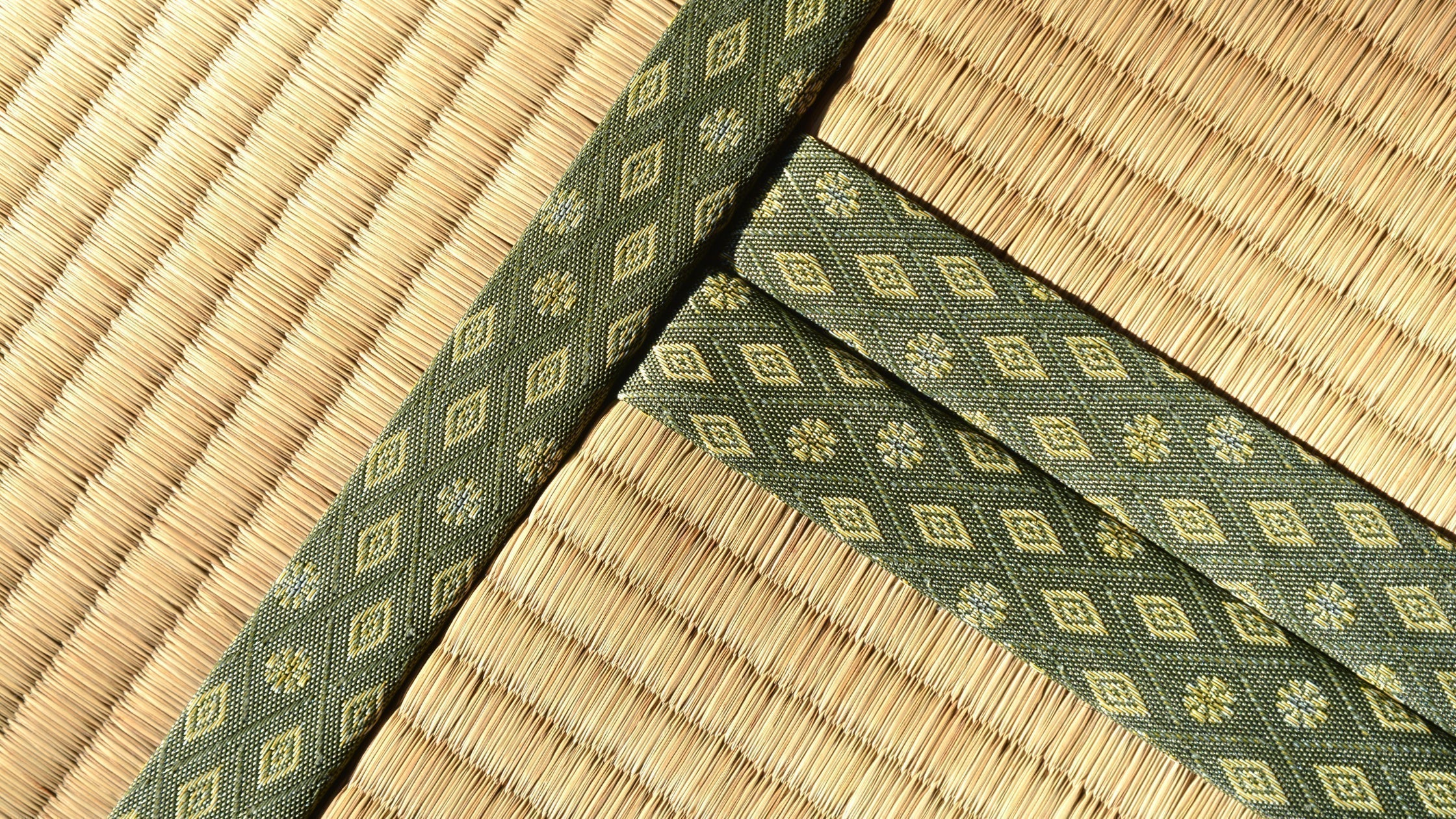 Traditional Japanese tatami mat made of woven rush grass, featuring a natural texture and elegant design for authentic Zen-inspired interiors.