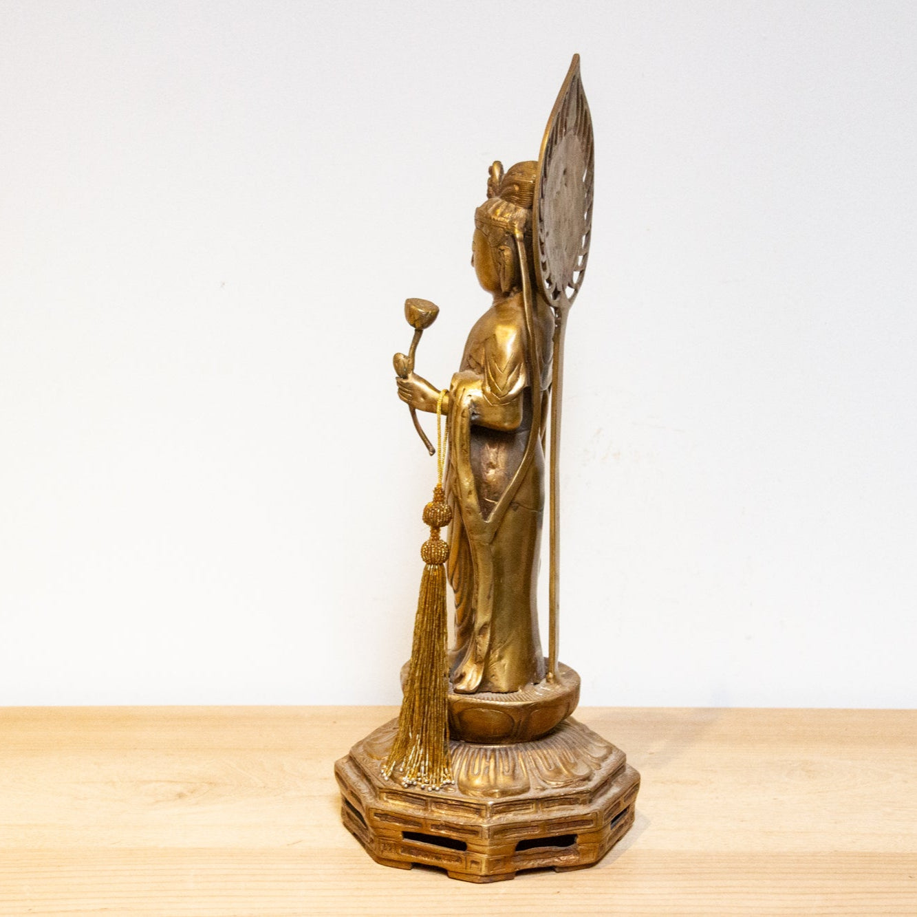 Vintage Japanese brass Buddha statue from the mid-20th century, tall Butsuzō sculpture with intricate details and serene expression.