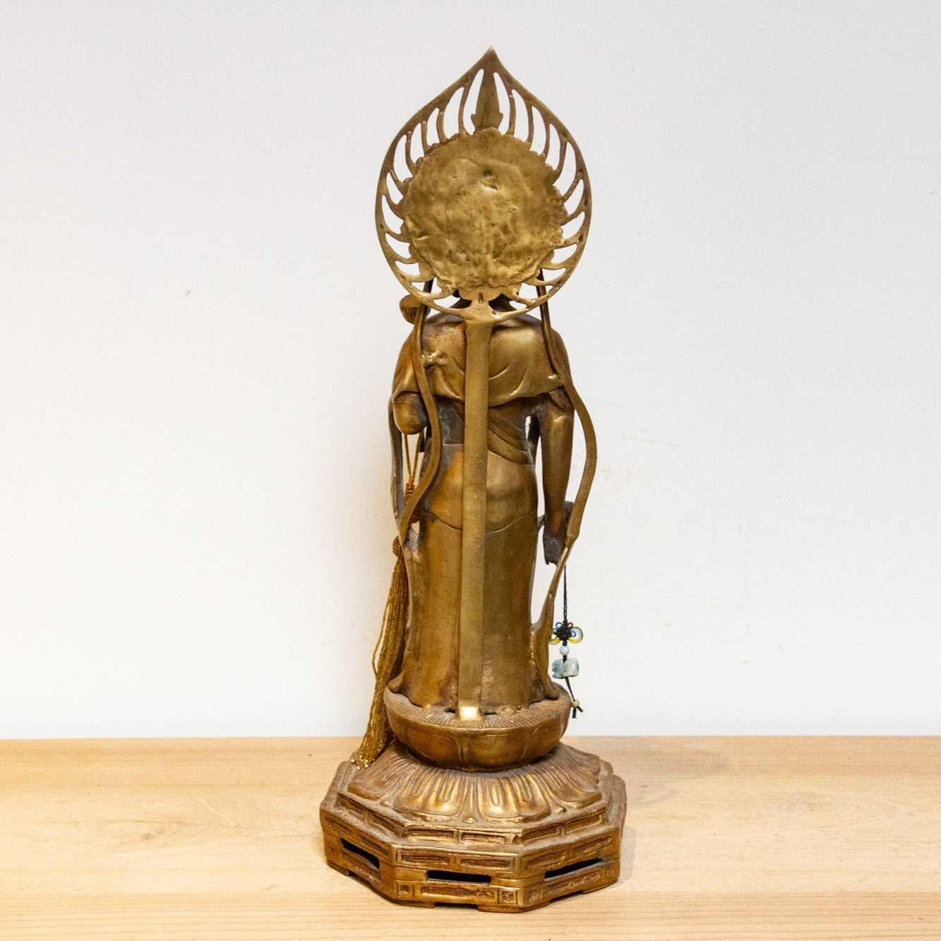 Vintage Japanese brass Buddha statue from the mid-20th century, tall Butsuzō sculpture with intricate details and serene expression.