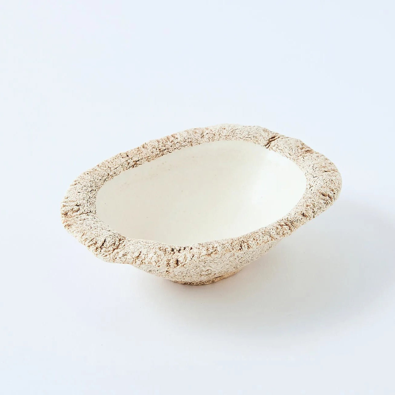 Hakuwa white oval bowl made from Japanese semi-porcelain and clay, handcrafted tableware for modern dining.