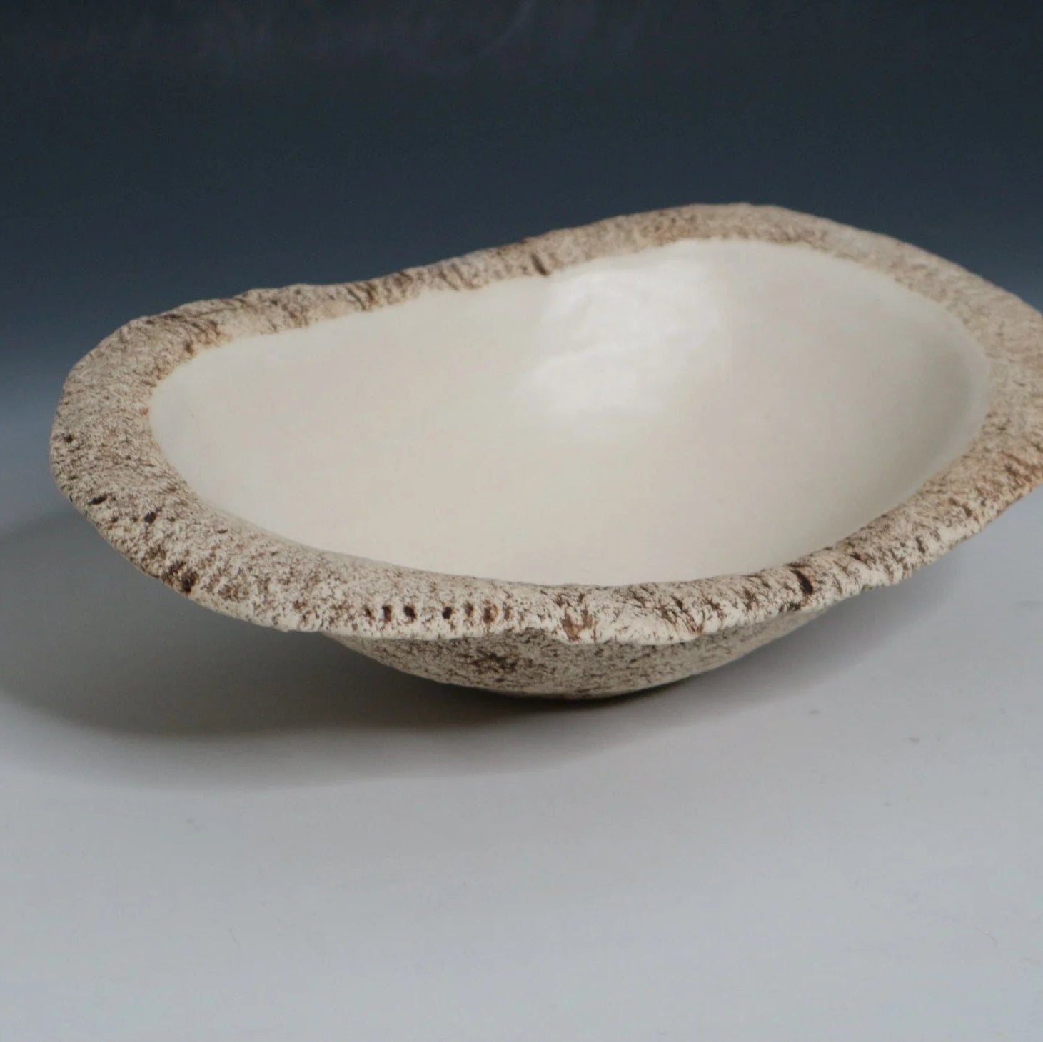 Hakuwa white oval bowl made from Japanese semi-porcelain and clay, handcrafted tableware for modern dining.