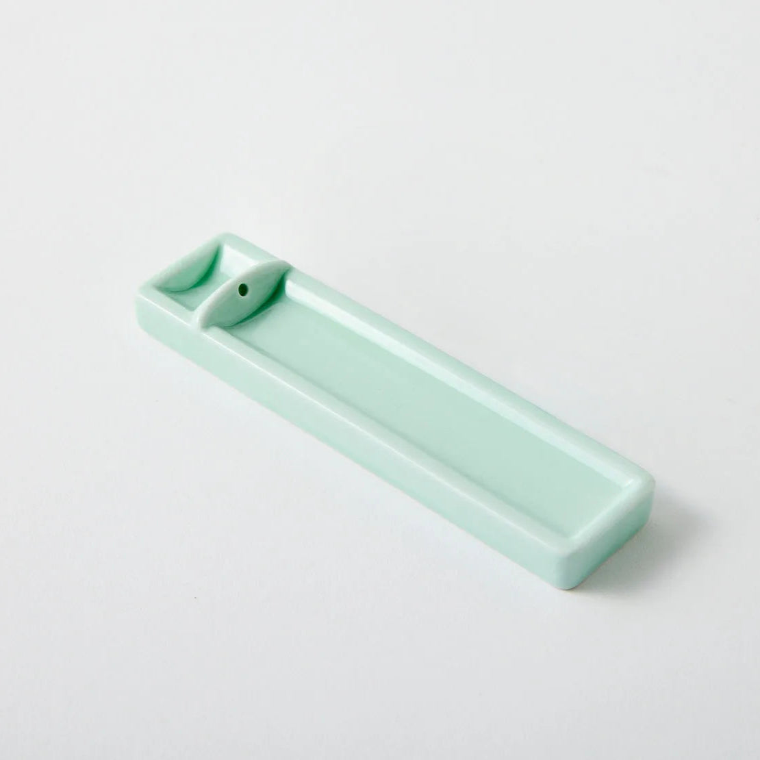 Handmade Japanese long celadon incense holder – ceramic tray for traditional and minimalist incense rituals.