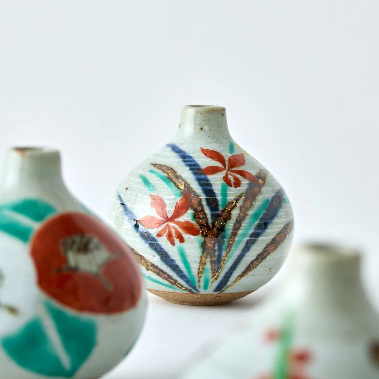 Japanese Tesai Kabin ikebana vase with Ran orchid motif, handmade slipware in Karatsu and Amakusa ceramic.