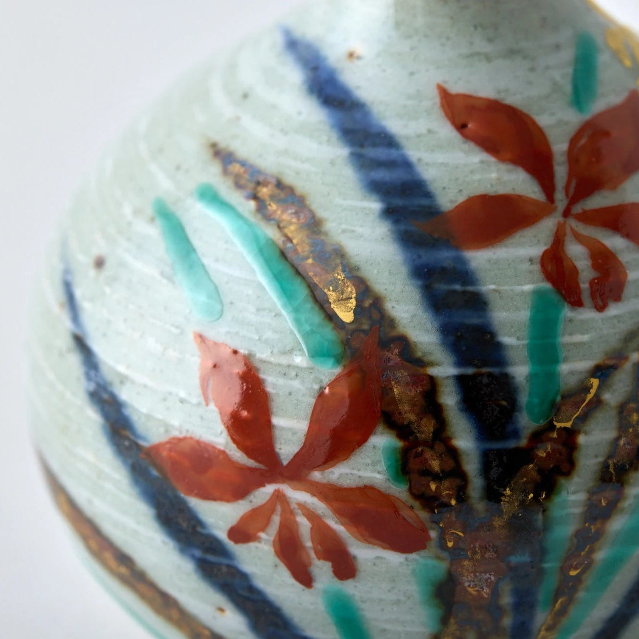 Japanese Tesai Kabin ikebana vase with Ran orchid motif, handmade slipware in Karatsu and Amakusa ceramic.
