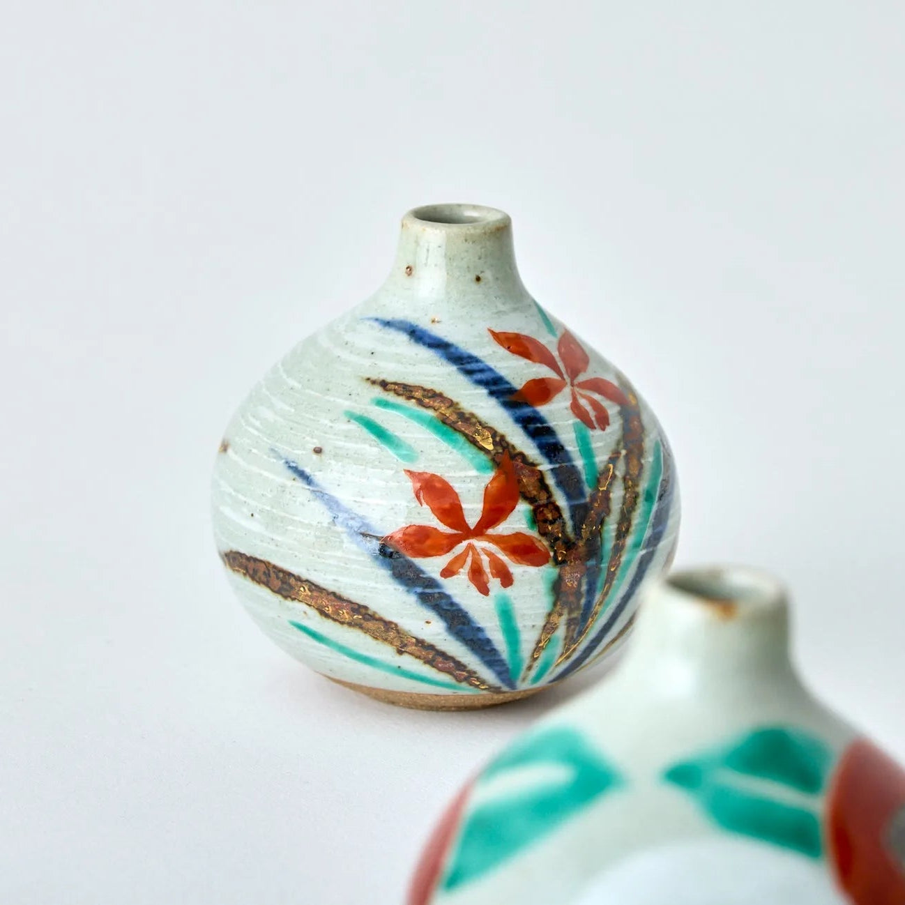 Japanese Tesai Kabin ikebana vase with Ran orchid motif, handmade slipware in Karatsu and Amakusa ceramic.