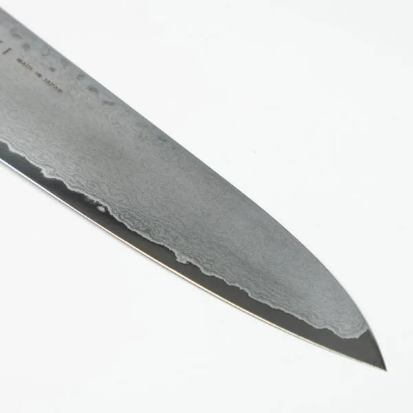 Kaizen 8.5-inch Japanese chef knife with lightweight blade and octagonal handle for precision cutting.