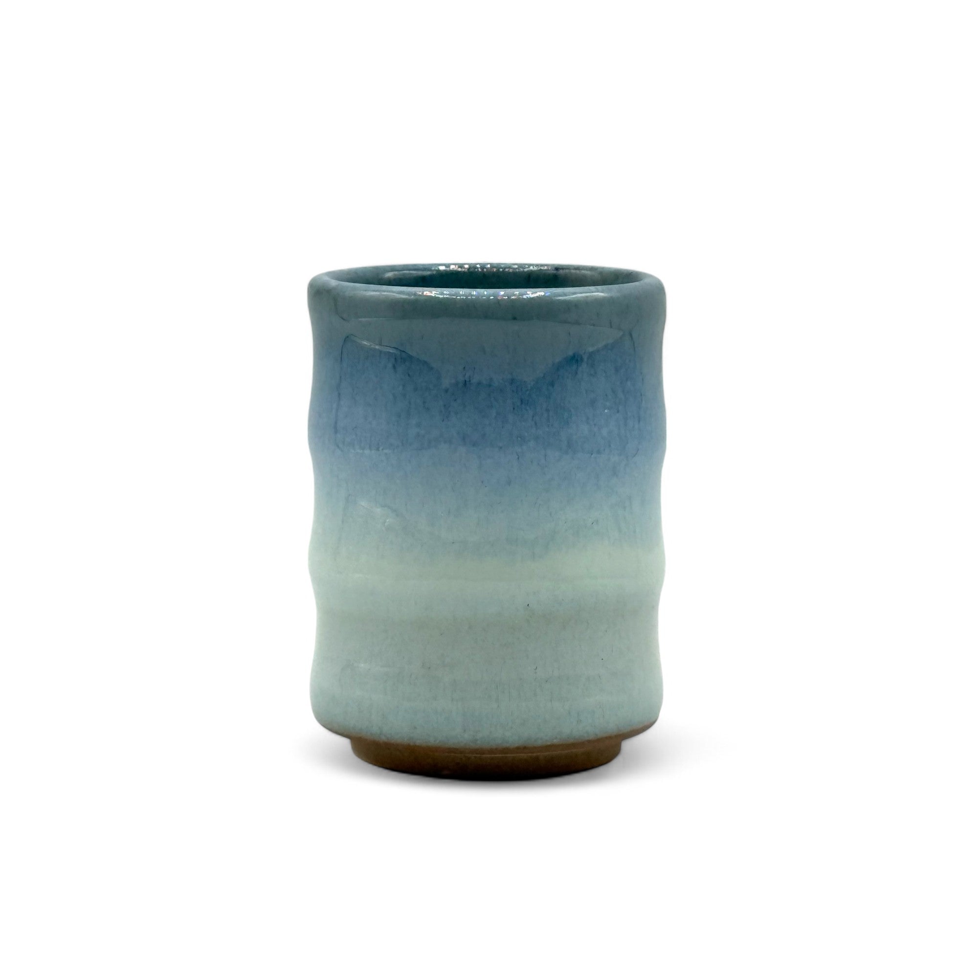Handcrafted Mino-yaki Yunomi Japanese teacup with traditional glaze, perfect for daily tea rituals.