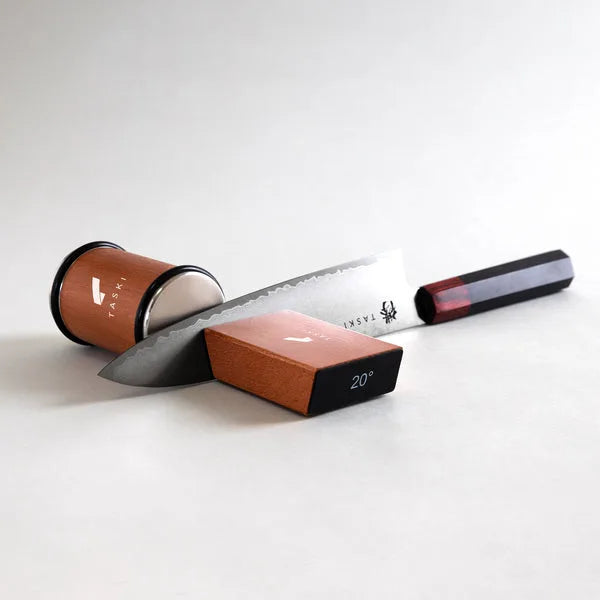 Rolling knife sharpener with diamond discs and angle guide for precise, easy blade sharpening.