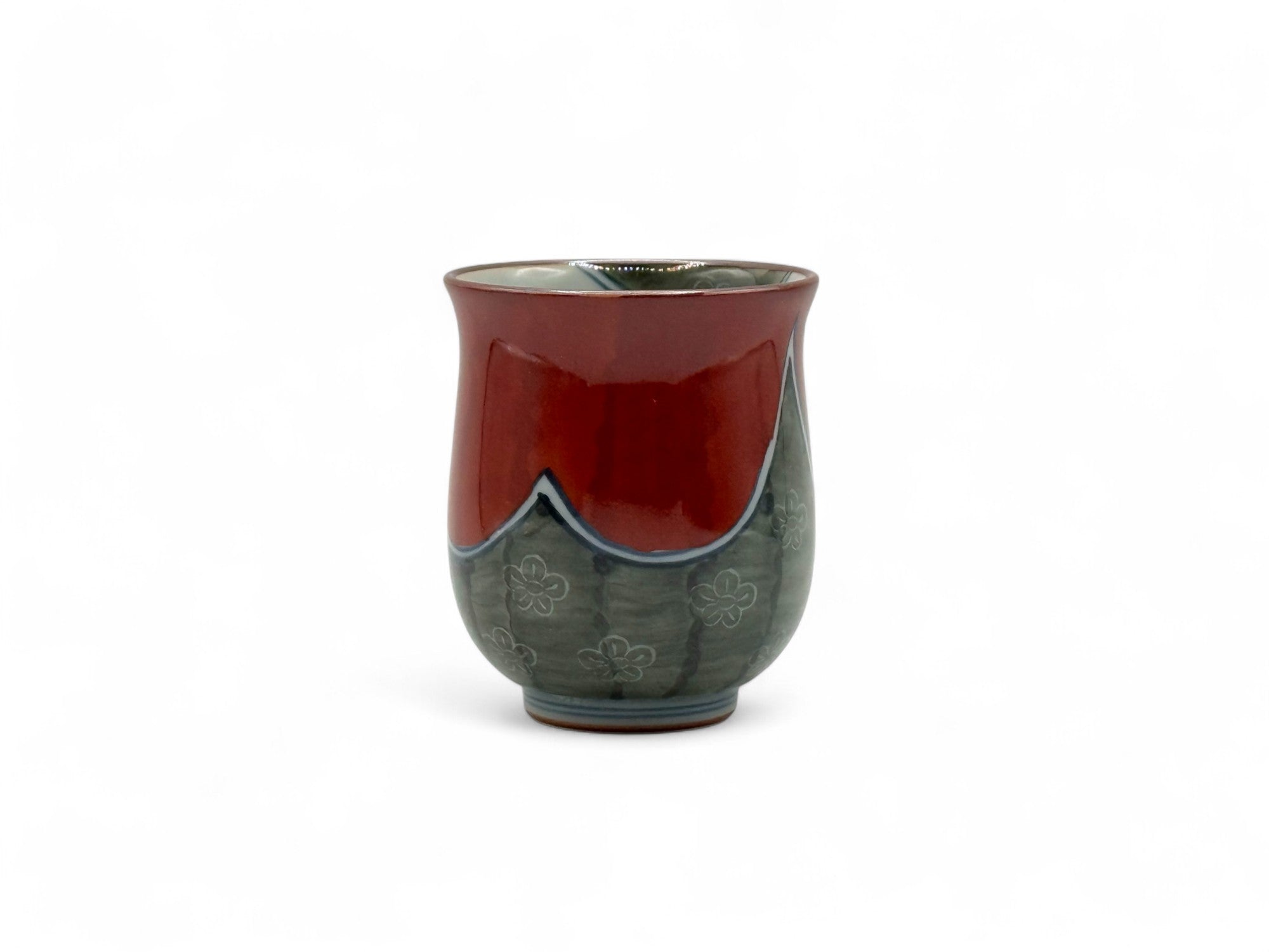 Handcrafted Hasami-yaki Yunomi Japanese teacup with traditional glaze, perfect for daily tea rituals.