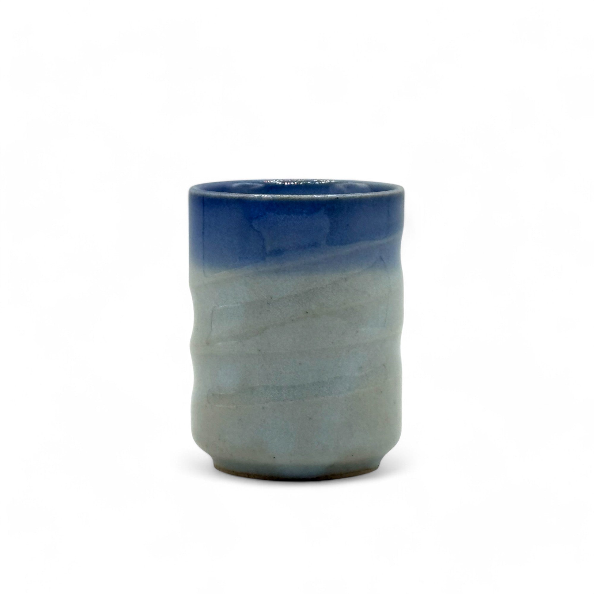 Handcrafted Mino-yaki Yunomi Japanese teacup with traditional glaze, perfect for daily tea rituals.