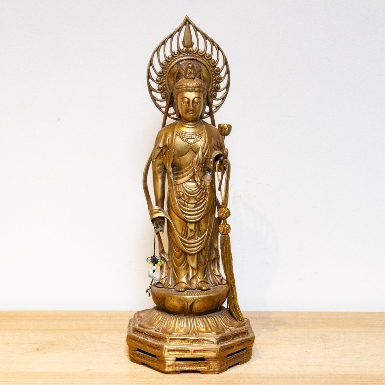 Vintage Japanese brass Buddha statue from the mid-20th century, tall Butsuzō sculpture with intricate details and serene expression.
