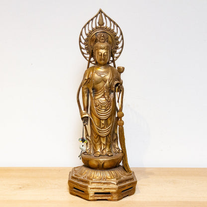Vintage Japanese brass Buddha statue from the mid-20th century, tall Butsuzō sculpture with intricate details and serene expression.