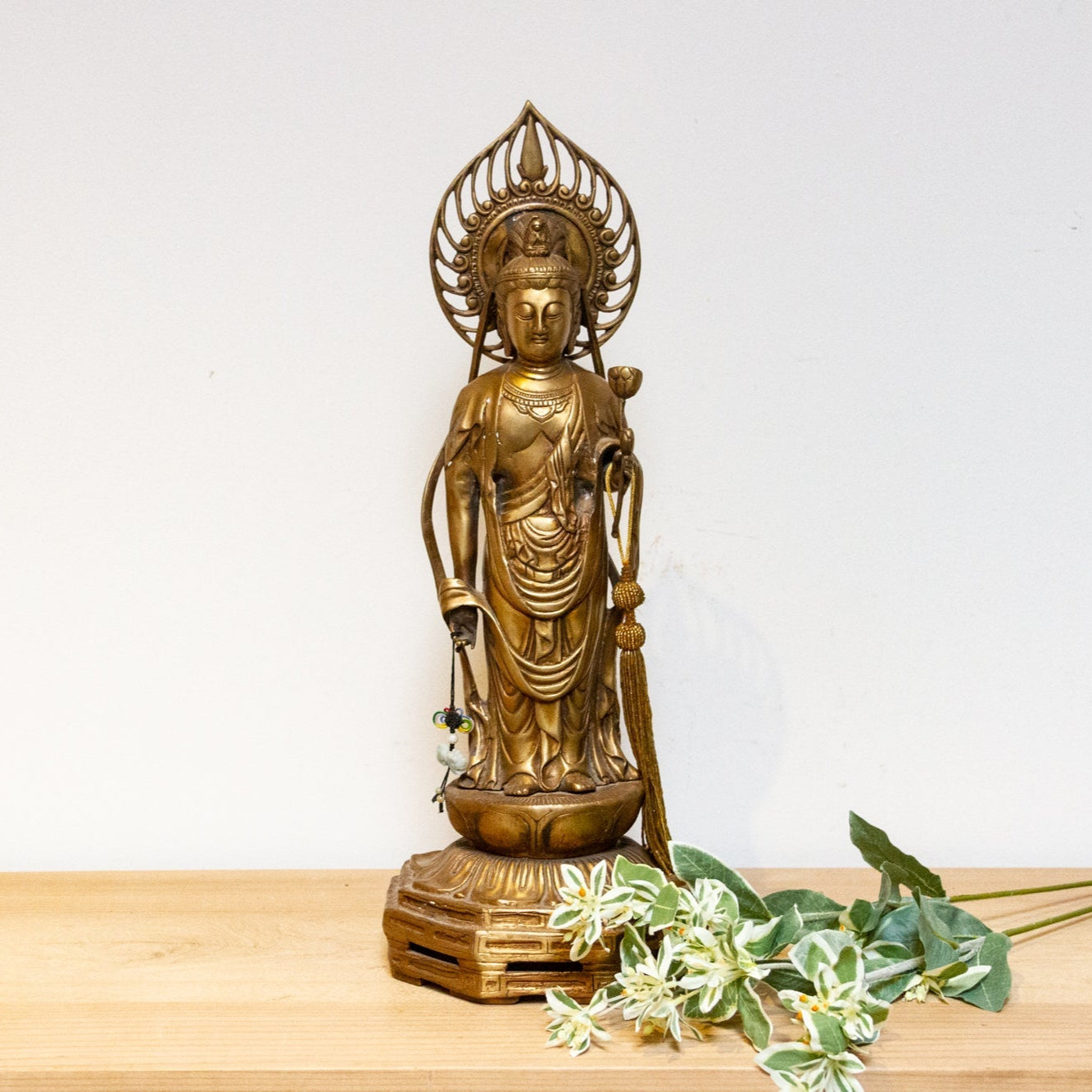Vintage Japanese brass Buddha statue from the mid-20th century, tall Butsuzō sculpture with intricate details and serene expression.