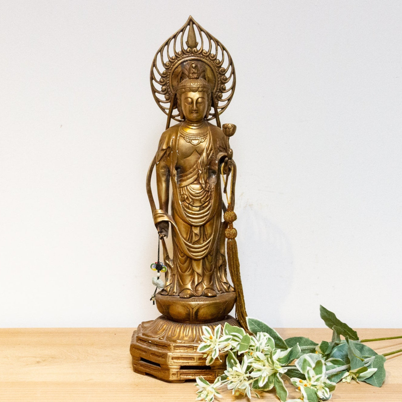 Vintage Japanese brass Buddha statue from the mid-20th century, tall Butsuzō sculpture with intricate details and serene expression.