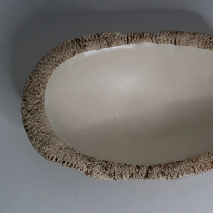 Hakuwa white oval bowl made from Japanese semi-porcelain and clay, handcrafted tableware for modern dining.