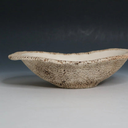 Hakuwa white oval bowl made from Japanese semi-porcelain and clay, handcrafted tableware for modern dining.