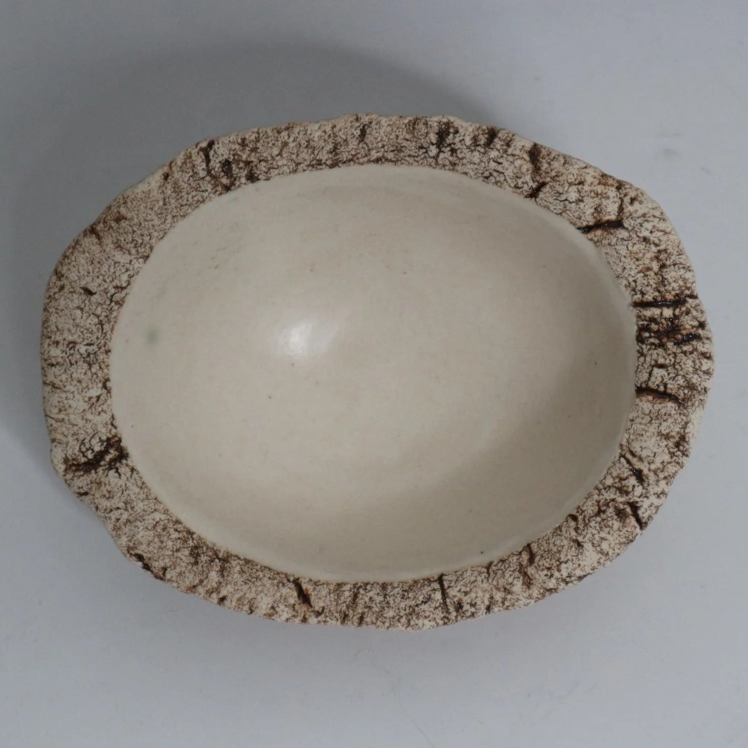 Hakuwa white oval bowl made from Japanese semi-porcelain and clay, handcrafted tableware for modern dining.