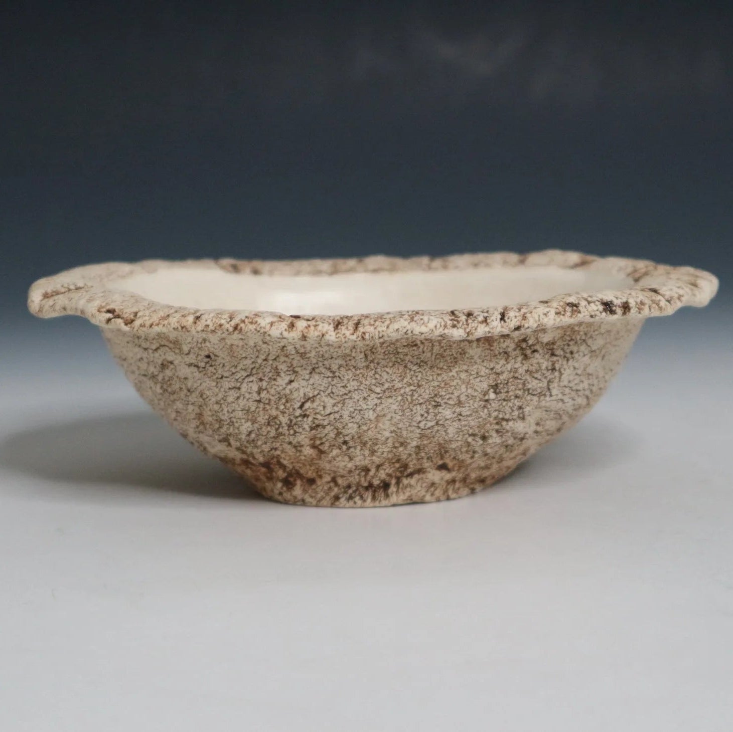 Hakuwa white oval bowl made from Japanese semi-porcelain and clay, handcrafted tableware for modern dining.
