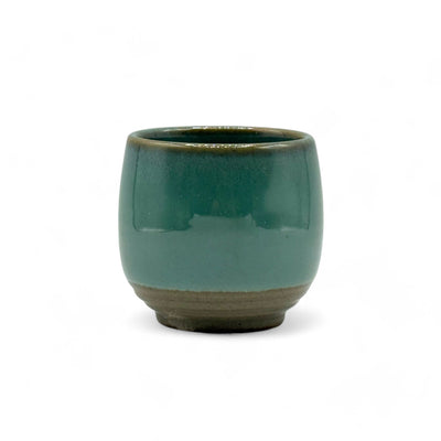 Handcrafted Mino-yaki Yunomi Japanese teacup with traditional glaze, perfect for daily tea rituals.