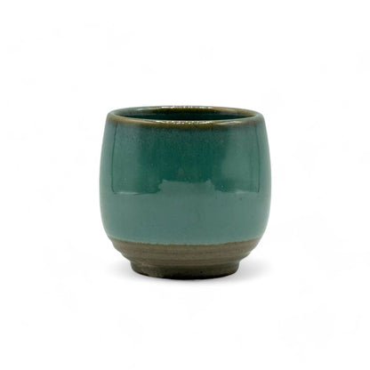 Handcrafted Mino-yaki Yunomi Japanese teacup with traditional glaze, perfect for daily tea rituals.