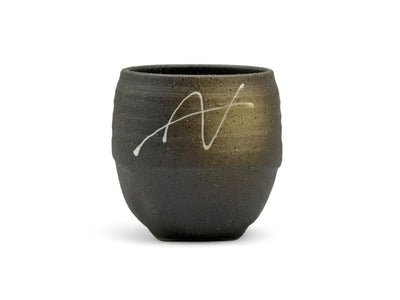 Handcrafted Mino-yaki Yunomi Japanese teacup with traditional glaze, perfect for daily tea rituals.