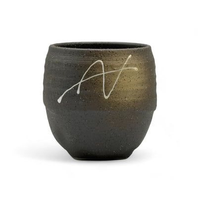 Handcrafted Mino-yaki Yunomi Japanese teacup with traditional glaze, perfect for daily tea rituals.