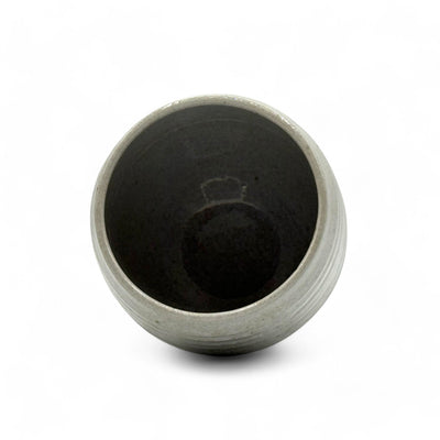 Handcrafted Mino-yaki Yunomi Japanese teacup with traditional glaze, perfect for daily tea rituals.