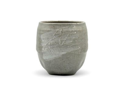 Handcrafted Mino-yaki Yunomi Japanese teacup with traditional glaze, perfect for daily tea rituals.