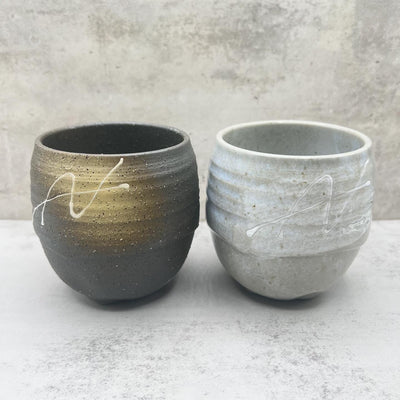 Handcrafted Mino-yaki Yunomi Japanese teacup with traditional glaze, perfect for daily tea rituals.