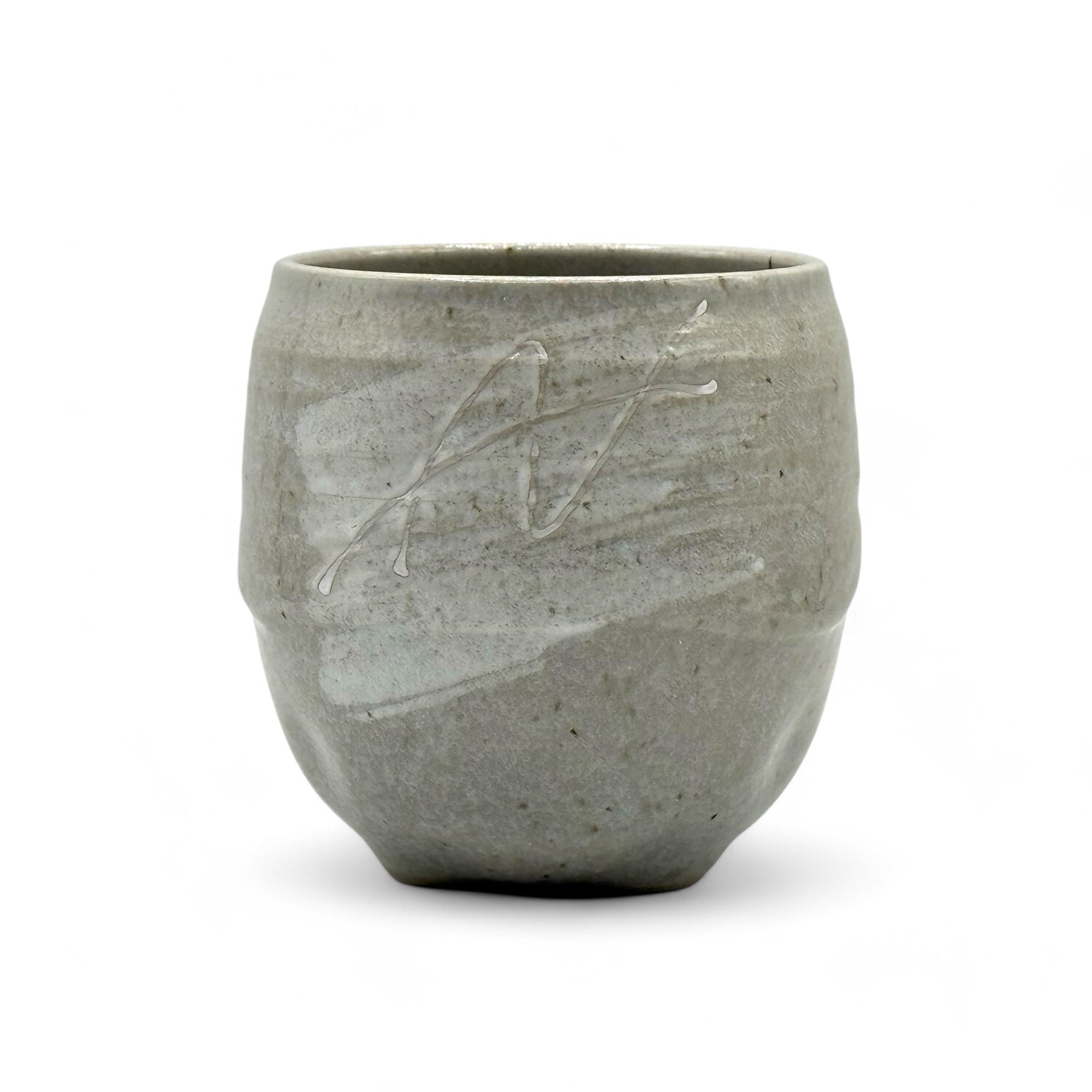 Handcrafted Mino-yaki Yunomi Japanese teacup with traditional glaze, perfect for daily tea rituals.