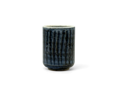 Handcrafted Mino-yaki Yunomi Japanese teacup with traditional glaze, perfect for daily tea rituals.