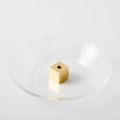 Japanese brass cube incense holder with glass plate, minimalist zen decor for home or meditation space.