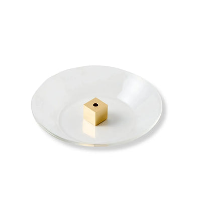 Japanese brass cube incense holder with glass plate, minimalist zen decor for home or meditation space.
