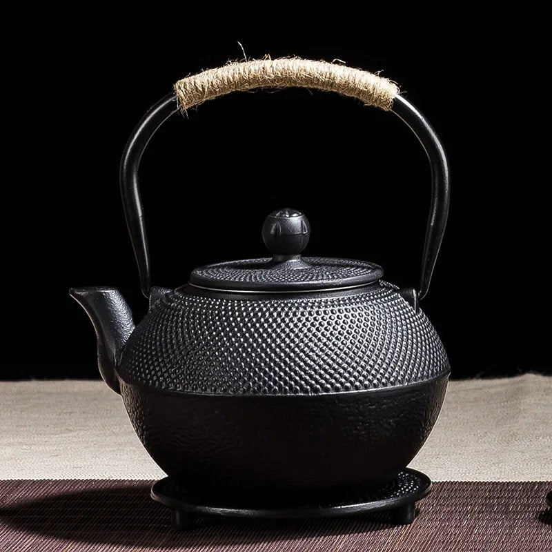 Japanese cast-iron teapot with tannin film covered interior, traditional design, and rust-resistant finish, perfect for brewing tea