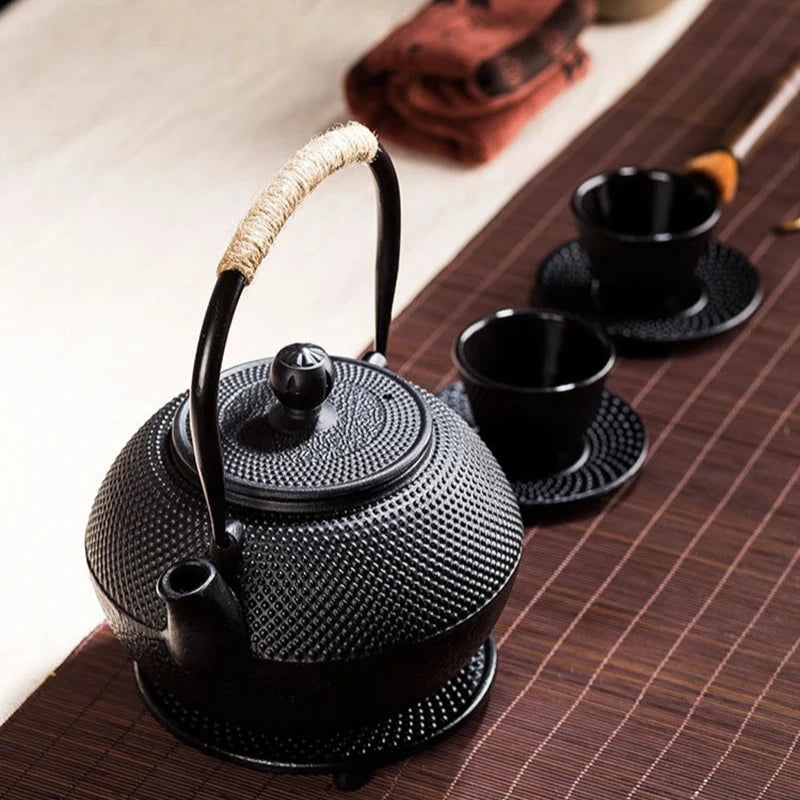 Japanese cast-iron teapot with tannin film covered interior, traditional design, and rust-resistant finish, perfect for brewing tea