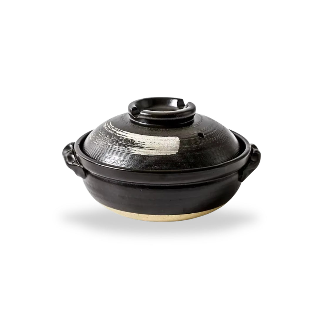 Traditional Japanese donabe clay pot with rustic design, perfect for slow-cooked meals and family-style serving.