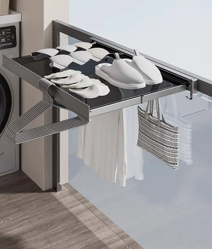 Lightweight, portable Japanese folding clothes rack with hooks, ideal for modern and minimalist home decor.