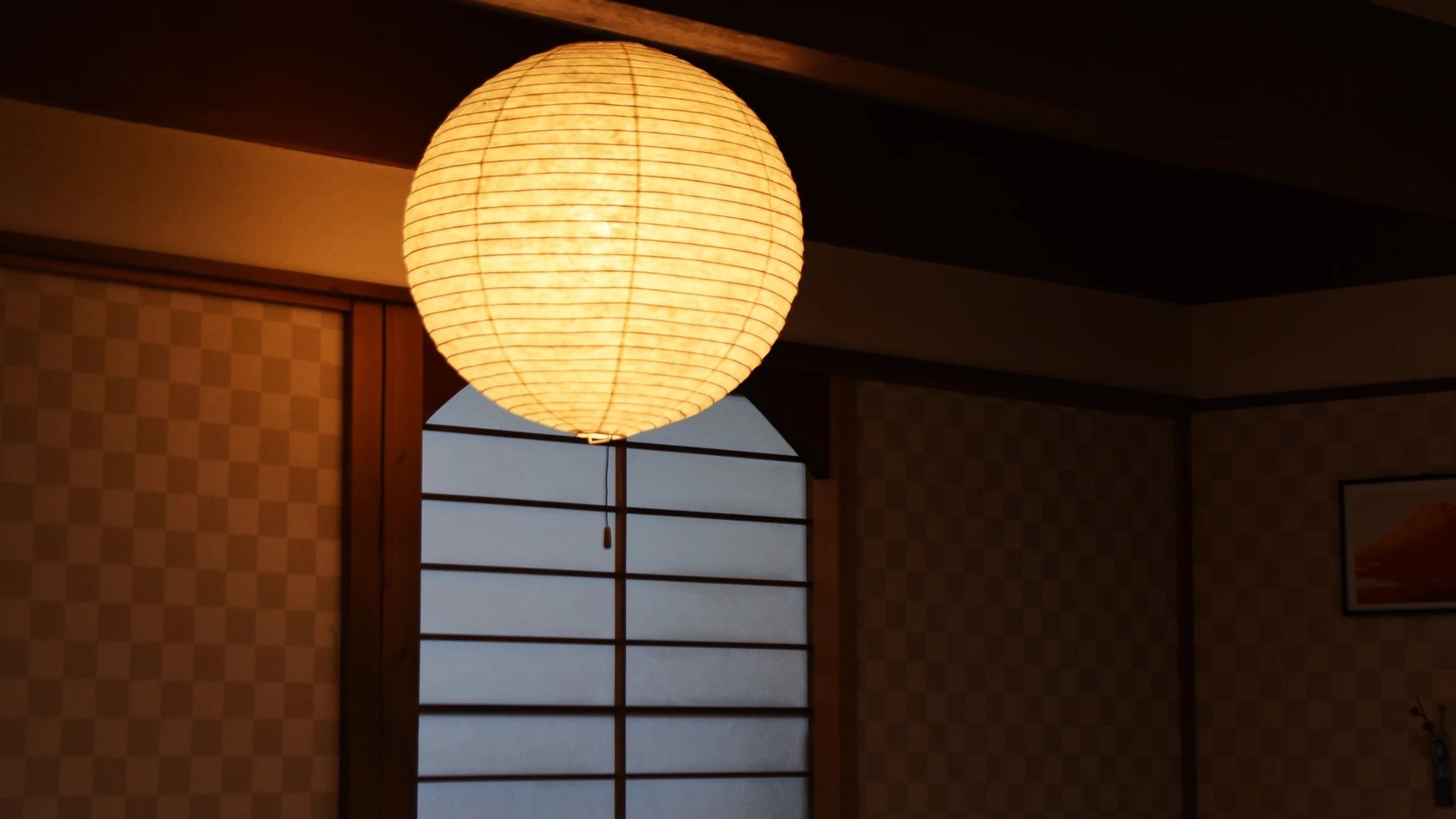 Japanese interior lighting with warm Japandi décor, soft ambient light, natural wood, and minimalist styling.