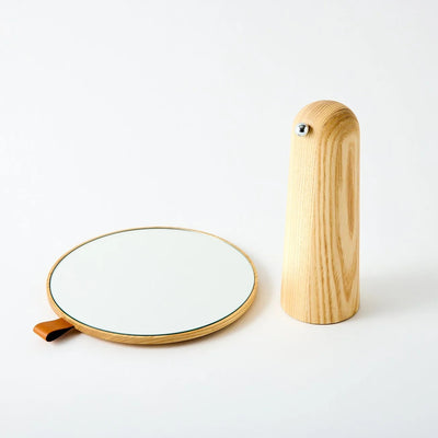 Elegant Japanese pivot mirror with 360° rotating design, perfect for modern and minimalist interior spaces.