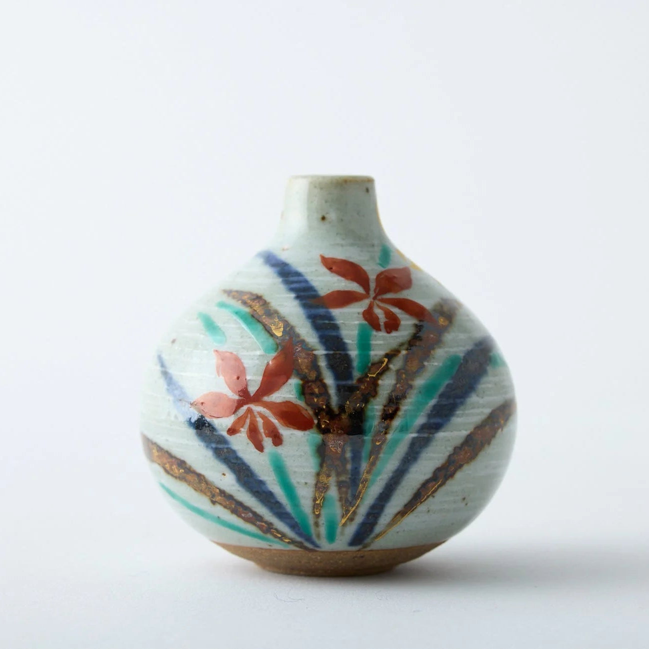 Japanese Tesai Kabin ikebana vase with Ran orchid motif, handmade slipware in Karatsu and Amakusa ceramic.