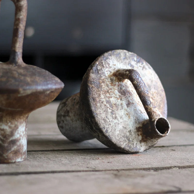 Handcrafted Japanese rough pottery ceramic vase with wabi-sabi aesthetic.