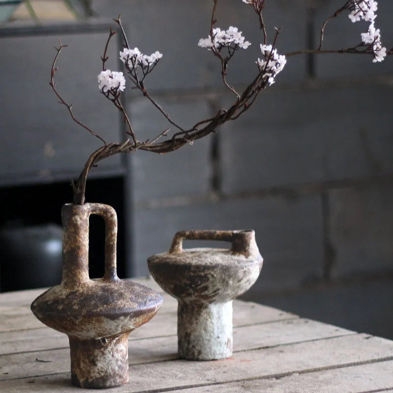 Handcrafted Japanese rough pottery ceramic vase with wabi-sabi aesthetic.