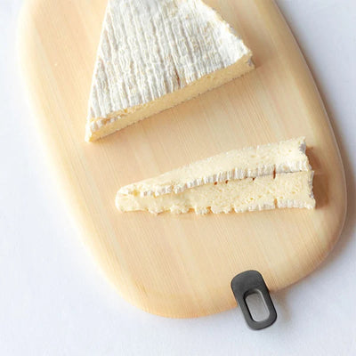 Japanese round wooden cutting board durable kitchen chopping board for food prep and serving.