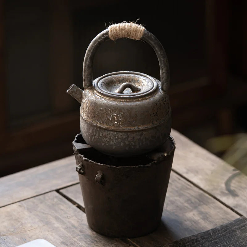 Handcrafted Japanese stoneware teapot with natural earthy design, perfect for brewing green, black, or herbal teas.