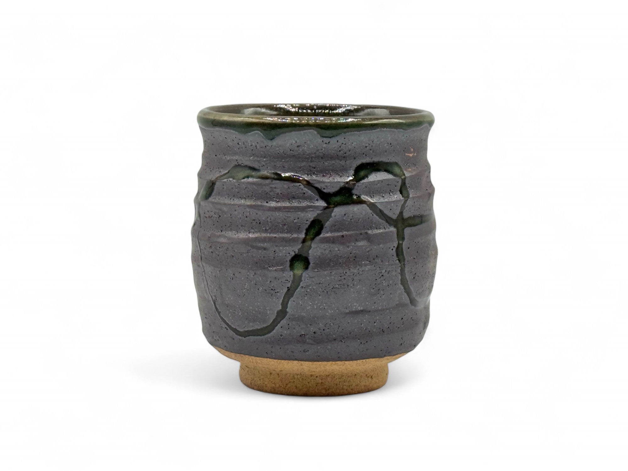 Handcrafted Mino-yaki Yunomi Japanese teacup with traditional glaze, perfect for daily tea rituals.