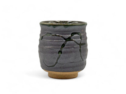 Handcrafted Mino-yaki Yunomi Japanese teacup with traditional glaze, perfect for daily tea rituals.