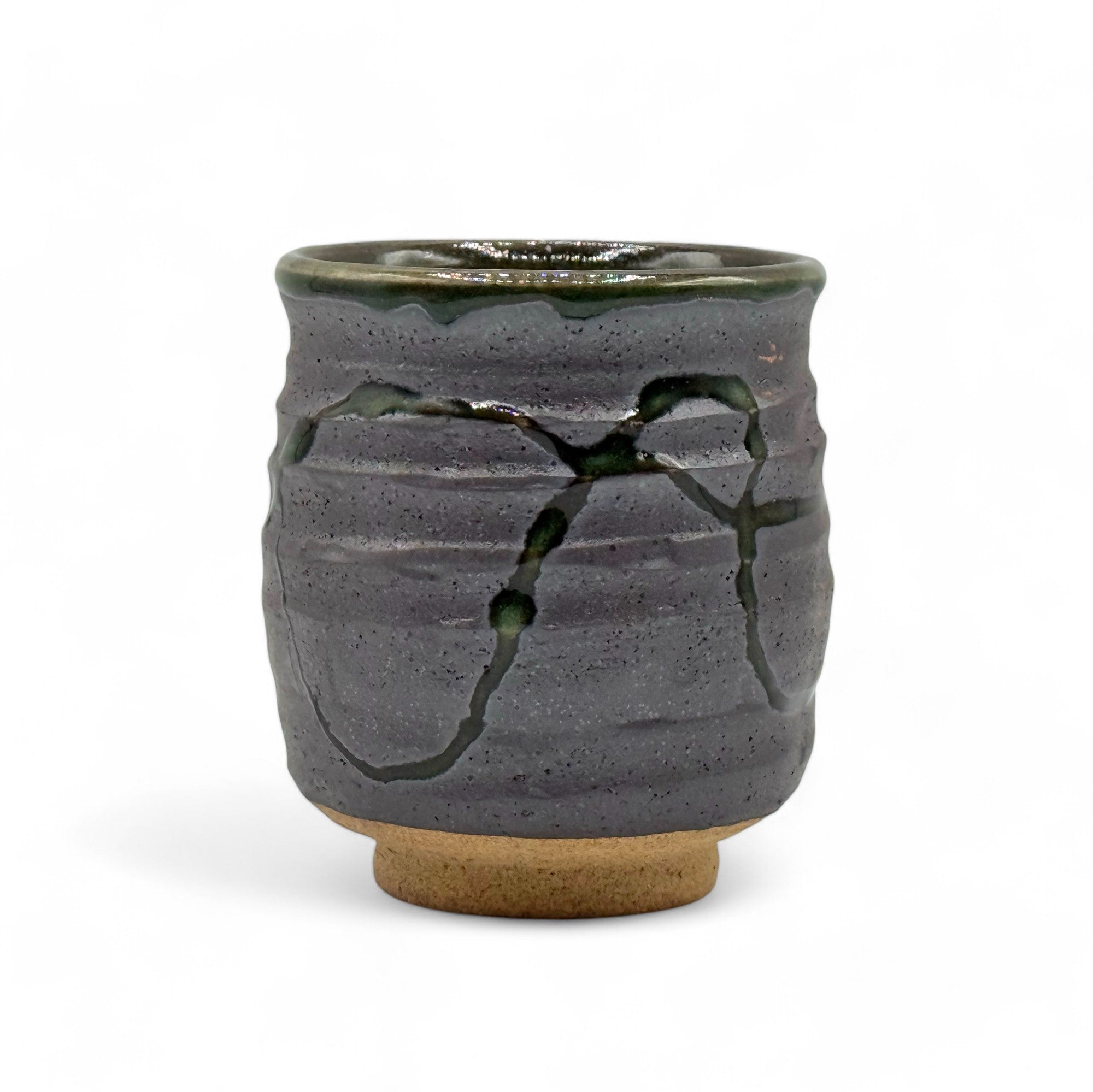 Handcrafted Mino-yaki Yunomi Japanese teacup with traditional glaze, perfect for daily tea rituals.