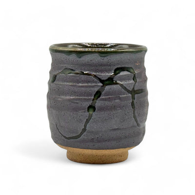 Handcrafted Mino-yaki Yunomi Japanese teacup with traditional glaze, perfect for daily tea rituals.