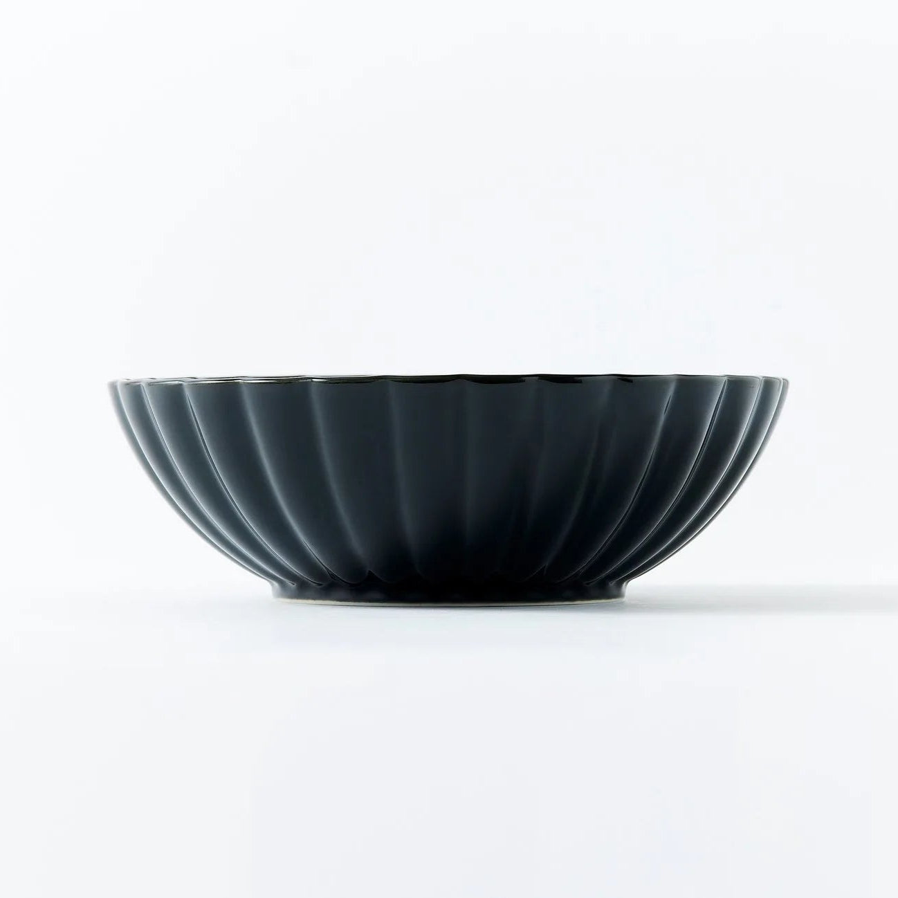 Kurokage large deep round bowl in ink black ceramic – elegant Japanese tableware for modern, minimalist dining.