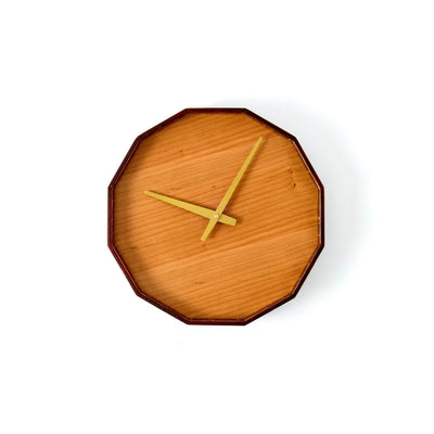 Mokuroku 12-sided Japanese wooden wall clock made of cherry wood with minimalist design and brass hands, handcrafted in Japan.